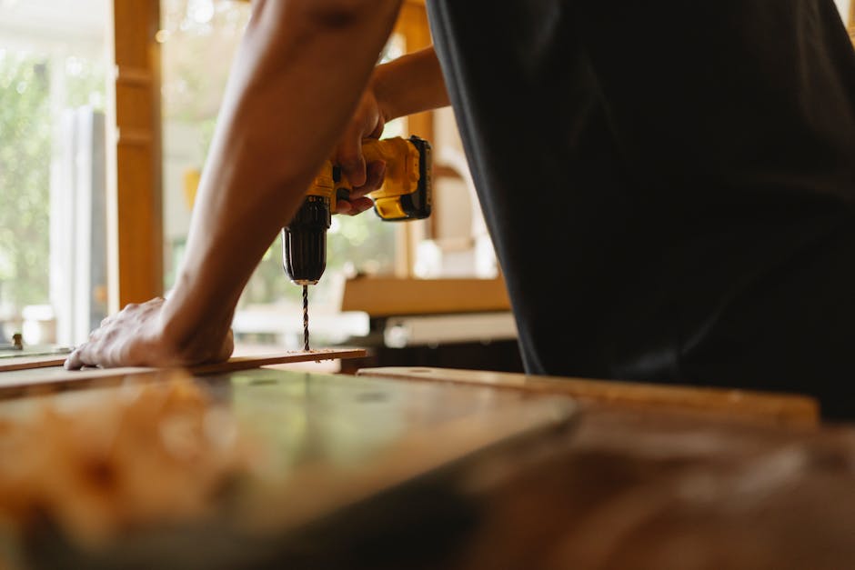 Professional carpenter installing door frame
